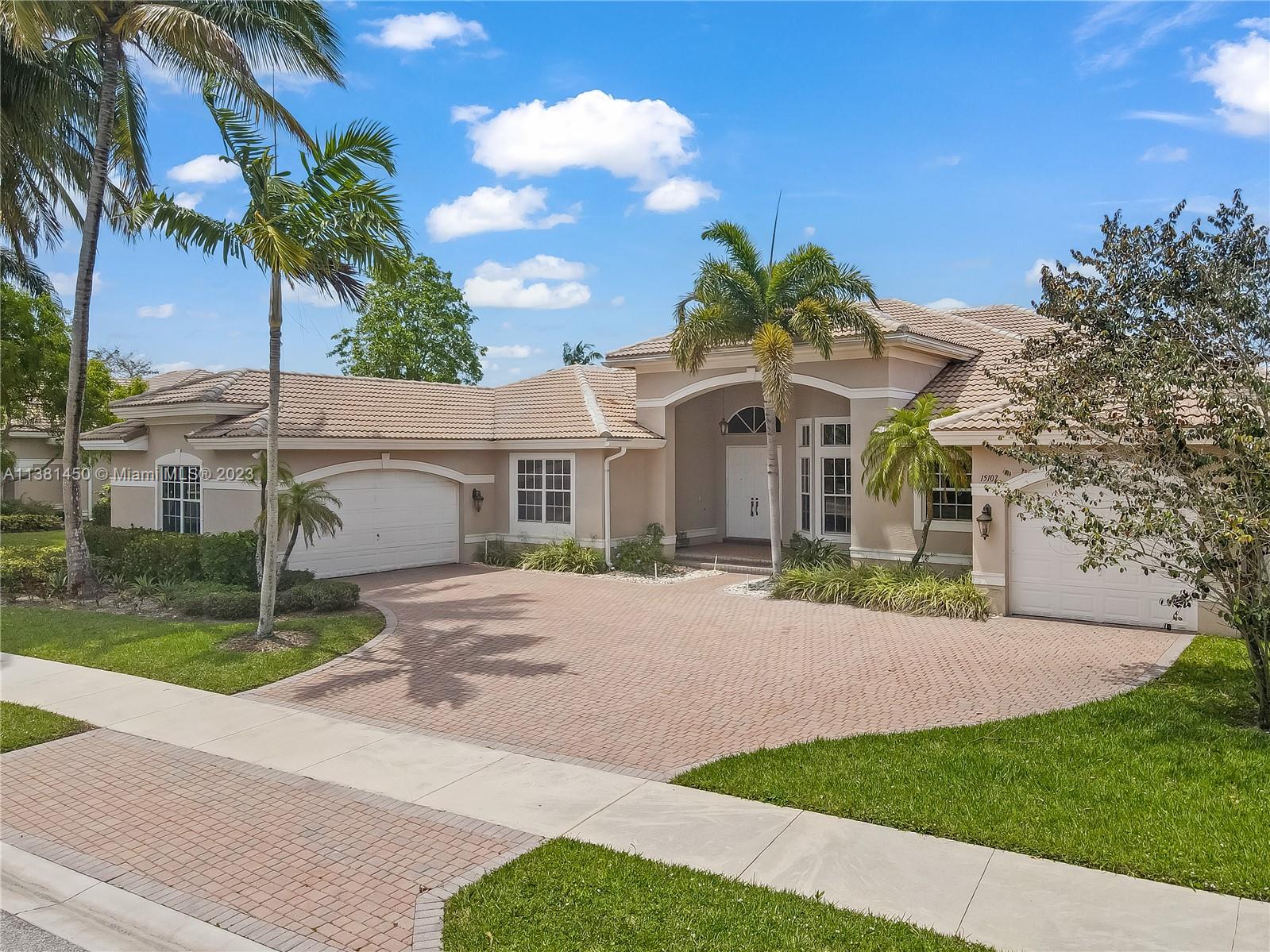 Stunning home in Davie! This 5 bedroom, 4.5 bath knockout features soaring ceilings, multiple living spaces, study with regal built-in bookshelves, and a formal dining room - perfect for entertaining! The kitchen is light, bright, and boasts sparkling granite counters, pantry, oversized island, serving bar, and built-in double oven - any chef's dream! Relax in the luxurious primary suite featuring tray ceiling, sitting area, patio access, dual vanity with Hollywood lighting, two walk-in closets, and garden tub with separate oversized shower stall. Located in the highly coveted neighborhood of Riverstone on nearly an acre, enjoy all the community has to offer just moments from tennis courts, playgrounds, clubhouse, and so much more! This one is a must see!