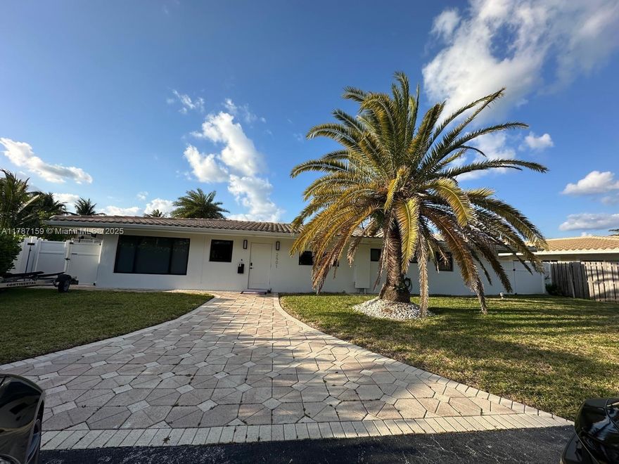 This rare find is great for boaters, families, or investors and NO HOA! With an 80 foot dock and only one fixed bridge, you will be to the ocean in minutes! It has been freshly renewed and painted inside, with new floors in bedrooms & an updated kitchen! There is also an outdoor shower and a separate laundry room accessible from the backyard. The large, circular driveway can fit at least 6 cars! Desirable location between the Hillsboro Inlet and Deerfield/ Boca Raton with many shops & restaurants and close to 95. Great for Airbnb or boaters! Hurry won't last!!!!