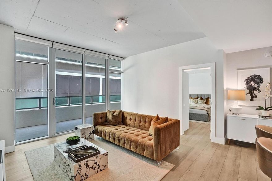 Look no further, this 1-bedroom, 1-1/2 bath residence at Four Midtown Miami offers 711 sq ft of bright, open living space with floor-to-ceiling impact glass and an oversized private balcony perfect for relaxing or entertaining. Recent upgrades include updated luxury vinyl flooring, new A/C system, new refrigerator, new washer & dryer, updated bathrooms, modernized finishes, and thoughtfully improved interiors that enhance both style and functionality. The open kitchen flows seamlessly into the living area, creating a comfortable and inviting layout. Generous closet space, in-unit laundry, and one assigned parking space on the same level add everyday convenience. HOA dues include proactive reserve funding designed to help minimize future increases or special assessments. Buyers may qualify for financing with as little as 3% down depending on lender and loan program.

Enjoy resort-style amenities including a rooftop heated pool, fitness center, sauna, 24-hour concierge, secured entry, and security patrol. Located in the heart of Midtown in a highly walkable neighborhood, steps from popular coffee shops, restaurants, boutiques, and daily conveniences, and just minutes to Wynwood and the Design District. Short-term rentals allowed with a 30-day minimum, ideal for end-users or investors.
