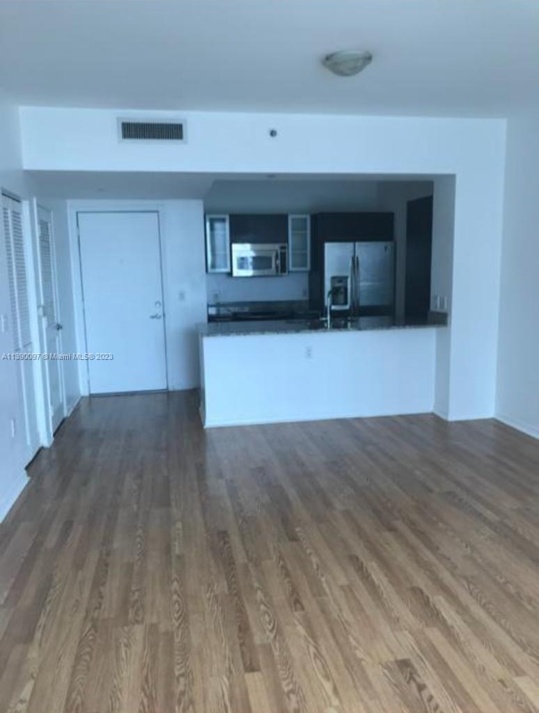Experience luxury living in this beautifully designed 1BR/1BA apartment at The Plaza's South Tower on Brickell Avenue. The unit boasts wood laminate flooring, an Italian-style cabinetry in the kitchen with granite countertops and stainless-steel appliances. Enjoy spectacular east-facing city views from the 23rd floor balcony. The building, designed by Arquitectonica, offers a lobby, pool, a fitness center, spa, theater, business center, club lounge, 24/7 security, concierge, and valet service. Prime location!