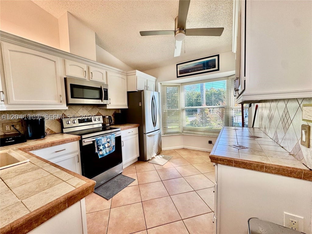 Photo of 11078 SE Sea Pines Cir, Hobe Sound, FL 33455 (MLS # A12041107)