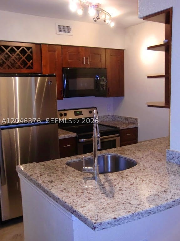 Photo of 2811 N Oakland Forest Dr #205, Oakland Park, FL 33309 (MLS # A12046376)