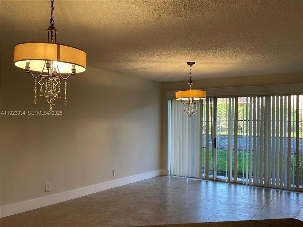 Photo of 8801 Wiles Rd #108, Coral Springs, FL 33067 (MLS # A11923934)