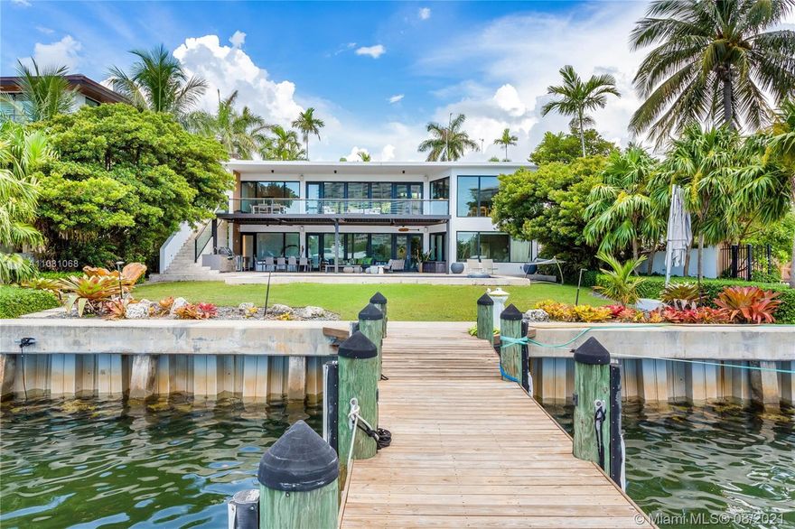 Completely redesigned in 2016, this spectacular modern home in Coconut Grove features 85 ft. of gorgeous waterfront. Expansive windows and doors let in natural light showcasing views of Biscayne Bay. Great for entertaining, the home features a heated saltwater pool, generator, summer kitchen and indoor/outdoor spaces overlooking the water. Helping define the striking home are designer finishes such as Oak wood and basalt stone countertops. This modern house exploits the best views on the second floor for the living areas and give residents on the ground level easy access to pool and dock. Excellent location near parks, shopping, dining and entertainment.