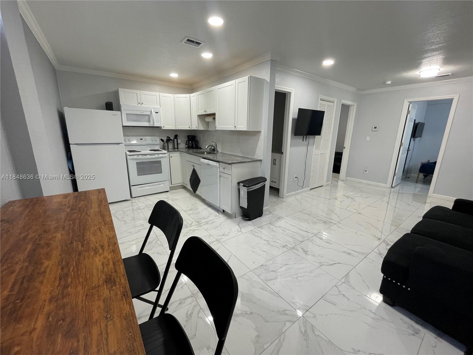 Stunning ground floor 2 bedroom, 1 bath. Utilities Included! No credit check needed. Washer/Drier in unit. Call/Text Matan for showings