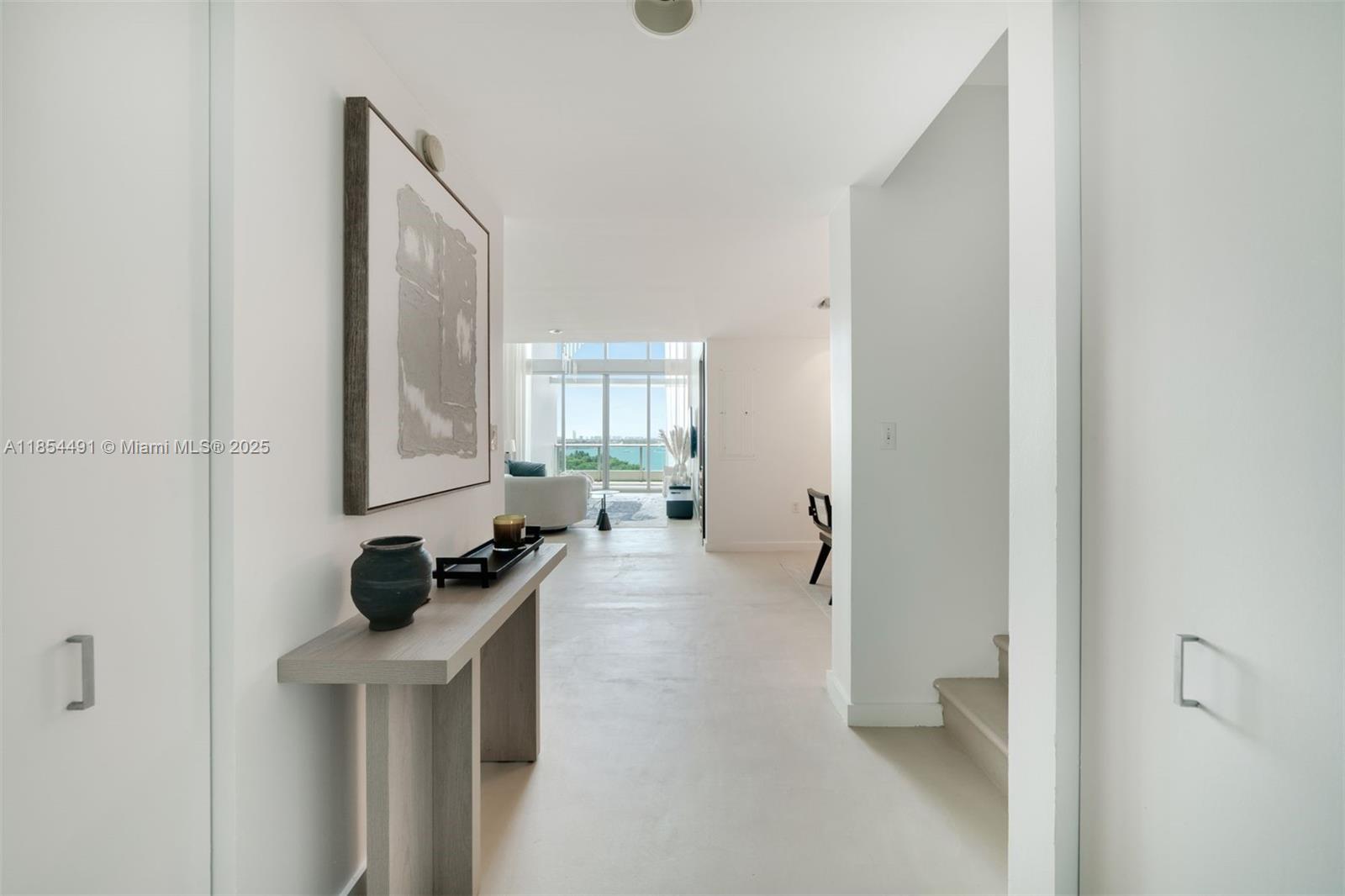 Captivating and Rare Sky-Home in the Heart of Miami! Indulge in the exclusivity of this light-filled two-story condo that present the ultimate in luxury living. This one of a kind unit boasts a distinctive floorpan with over 1,600 sqft of living space as well as 350qft of terraces over two stories. With soaring 20ft ceilings and two balconies, this residence bathes in an abundance of natural light, creating an inviting and airy atmosphere. The layout comprises 3 bedrooms, a den, and 3 bathrooms, providing ample space for comfortable living. Enjoy unobstructed water and park views in one of Miami's most iconic buildings 900 Biscayne Bay. Available to show starting August 20th.