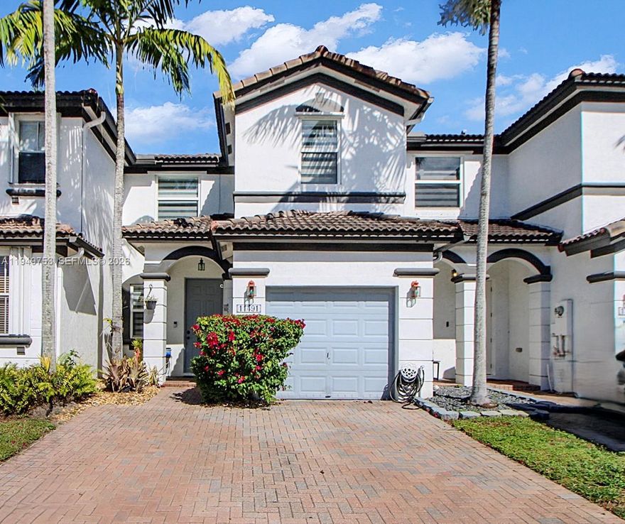 Beautiful and bright 3-bedroom, 2.5-bath townhouse located in the highly desirable Islands at Doral – Windward gated community. This move-in-ready home offers a spacious open layout filled with natural light, impact windows throughout, and a fully remodeled kitchen featuring quartz countertops and new appliances.

Enjoy a private backyard with breathtaking lake views and stunning sunsets, perfect for relaxing or entertaining. The unit includes a washer and dryer conveniently located on the second floor, a one-car garage, two driveway spaces, and additional guest parking.

Residents enjoy 24/7 gated security and resort-style amenities including a clubhouse, swimming pools, fitness center, tennis and basketball courts, walking and biking trails, kids’ playground, and beautifully maintained lakes and landscaping.

Ideally located near top-rated schools, Dolphin Mall, International Mall, restaurants, cafés, grocery stores, major highways, and just 20 minutes from Miami International Airport.

Easy to show!
