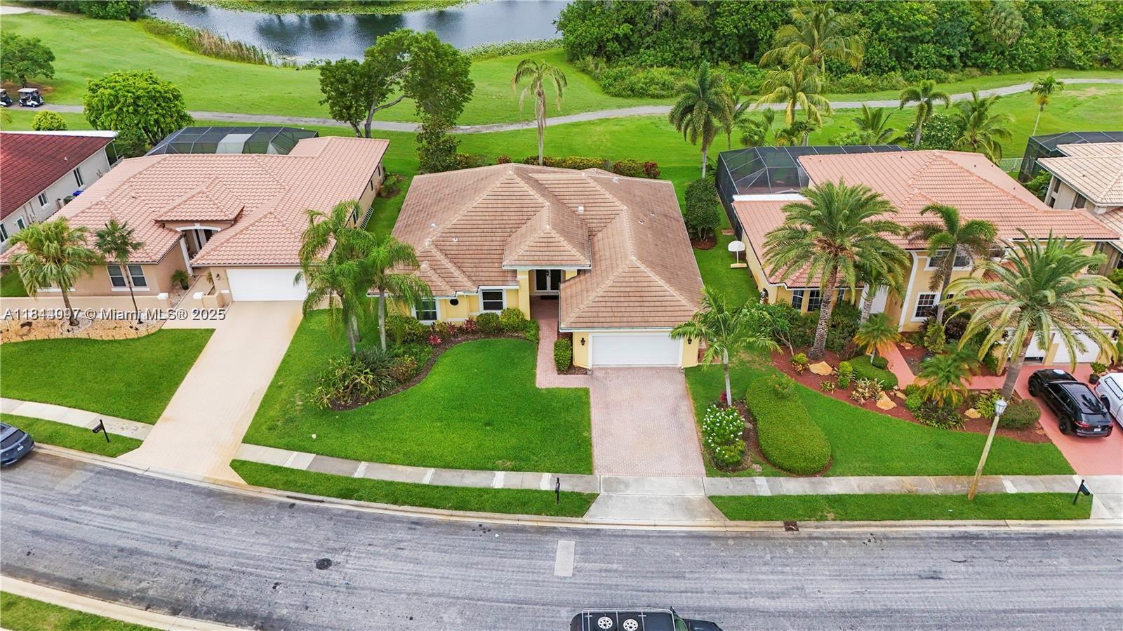 Stunning 4BR/2BA Home located on the in the highly sought-after gated community of Grand Palms Golf Course in Pembroke Pines, FL. This beautifully upgraded home blends luxury, comfort & energy efficiency with breathtaking views of the 9th hole. Interior features includes elegant marble & 100% hardwood floors, spa like master bath, an open floor plan, light-filled layout with impact windows & doors (2021). The modern kitchen includes energy-efficient appliances. New A/C & water heater offer year-round comfort. Oversized 2-car garage with ample storage. Backyard opens to the course, offering serene views. New roof (2021), low HOA & resort-style amenities. Easy to show call today.