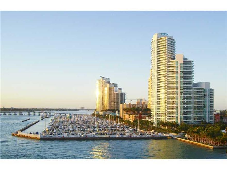 Temporarily Price Reduced for Immediate Sale! True flow-through premier condo w/ unobstructed views of the Ocean, Fisher Island, Cruise Ships, & the downtown Miami skyline. Beautifully appointed w/ custom built-in bar & restored Italian stone floors in ma in living areas.  Poggen Pohl kitchen w/ Miele appliances, upgraded washer/dryer, & eat-in bar area featuring spectacular unobstructed Ocean views.  Entertainment system w/ built in speakers, & electric window treatments in all rooms.