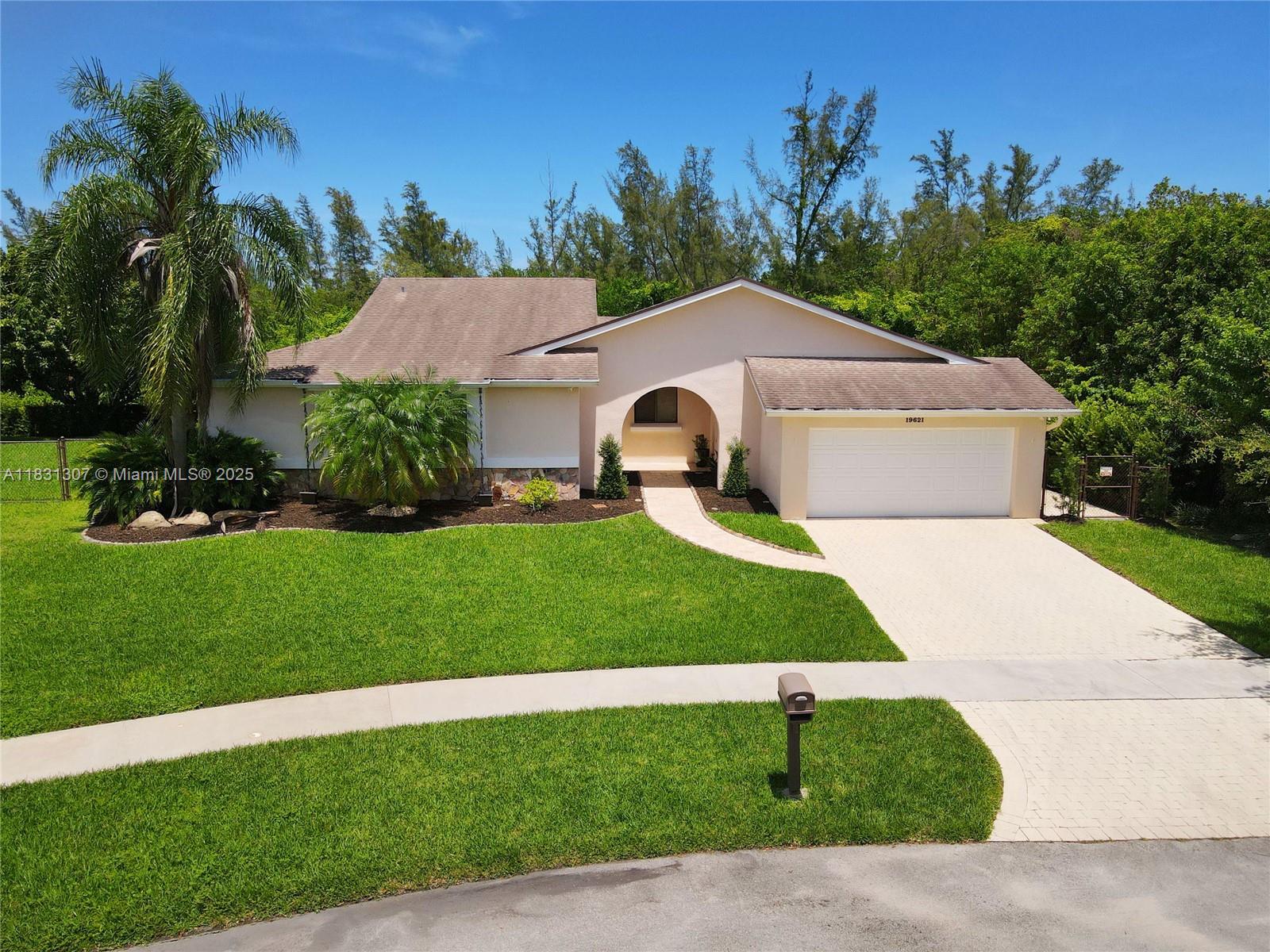 Located in the heart of Cutler Bay’s sought-after Saga Bay community, this 3-bedroom, 2-bath residence offers a light-filled interior with volume ceilings and an open-concept design. A charming courtyard-style entrance adds privacy and curb appeal, welcoming you into a home designed for comfortable living and entertaining. Additional highlights include a formal dining room, spacious bedrooms, separate tub and shower in primary suite, lots of closet space, indoor laundry room, and 2-car garage. The expansive yard provides plenty of room for a pool. Close to shops, restaurants, and turnpike. Don’t miss this opportunity to make your move into one of Cutler Bay’s most desirable neighborhoods.