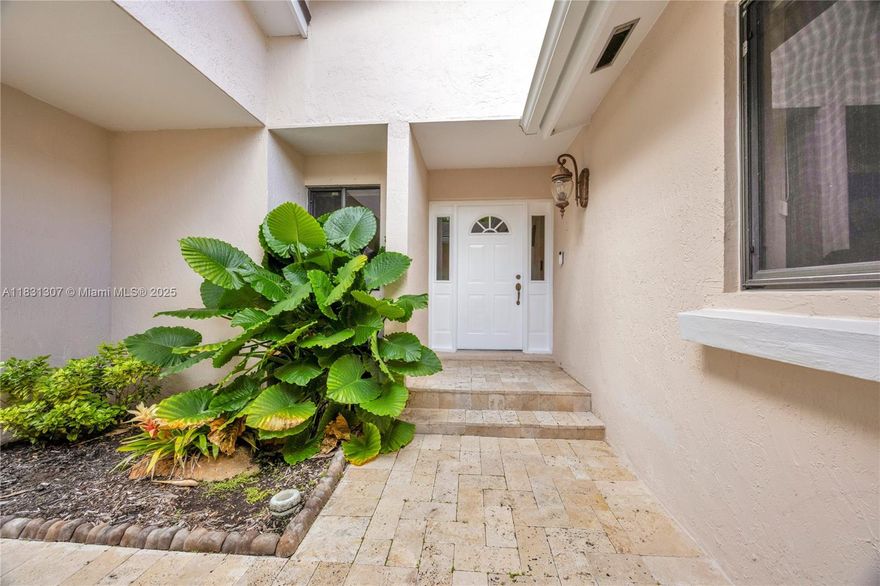 Located in the heart of Cutler Bay’s sought-after Saga Bay community, this 3-bedroom, 2-bath residence offers a light-filled interior with volume ceilings and an open-concept design. A charming courtyard-style entrance adds privacy and curb appeal, welcoming you into a home designed for comfortable living and entertaining. Additional highlights include a formal dining room, spacious bedrooms, separate tub and shower in primary suite, lots of closet space, indoor laundry room, and 2-car garage. The expansive yard provides plenty of room for a pool. Close to shops, restaurants, and turnpike. Don’t miss this opportunity to make your move into one of Cutler Bay’s most desirable neighborhoods.