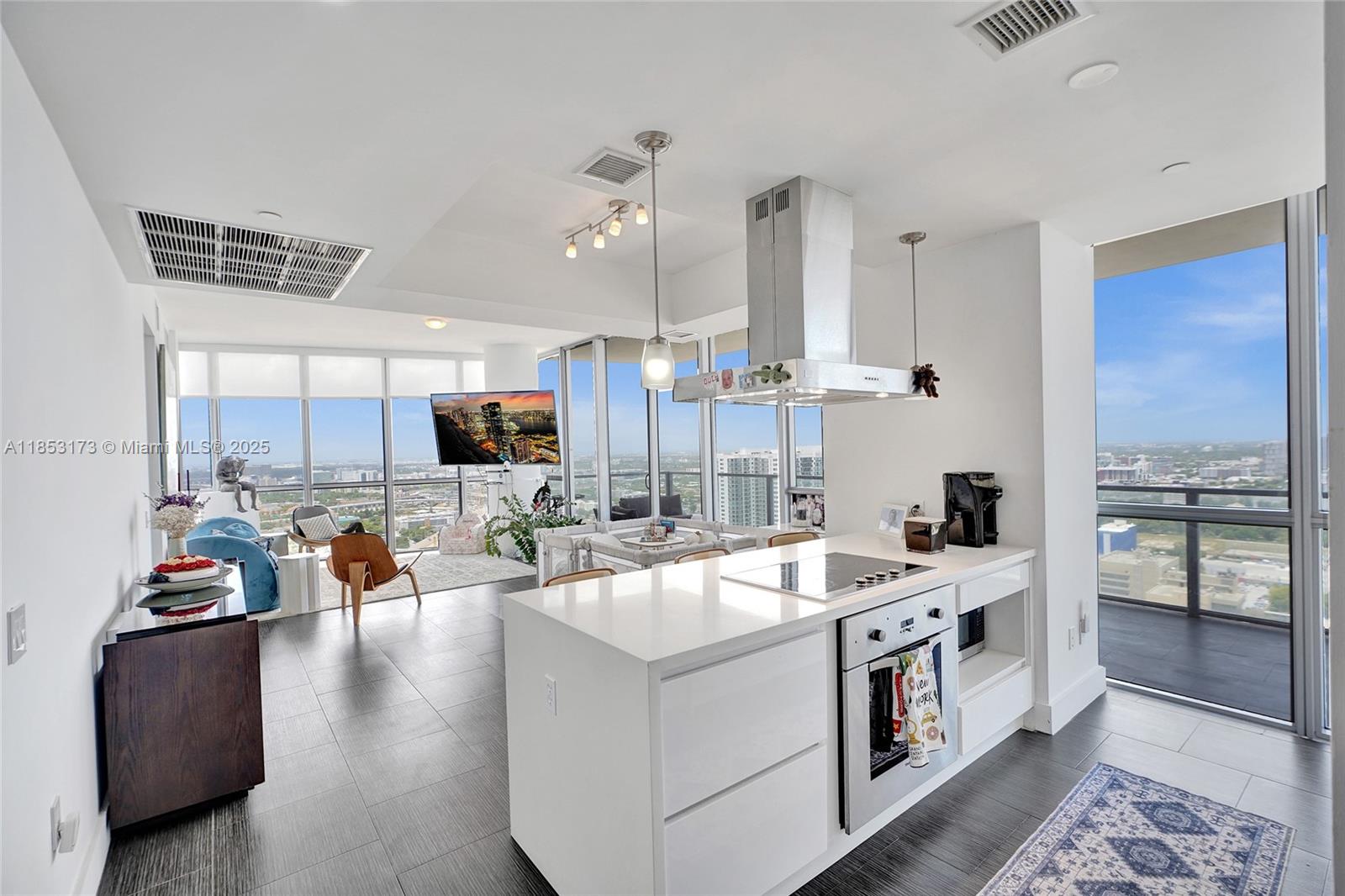 Live above the clouds in this newly renovated 2-bed, 2-bath residence at the Marquis. This 37th-floor home features a private elevator, panoramic city and bay views, and 1,647 sq. ft. of modern luxury. Interior upgrades include a dual-zone smart AC system, smart toilet, electric blinds, rain showers, frosted glass accents, and sleek tile flooring throughout. Residents enjoy resort-style amenities plus access to an exclusive private beach club at the Hilton South Beach. Ideally located just steps from parks, stadiums, top dining, and only a few blocks from the vibrant new Miami Worldcenter district.