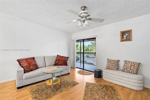 Photo of 10715 W Clairmont Cir #212, Tamarac, FL 33321 (MLS # A11859609)