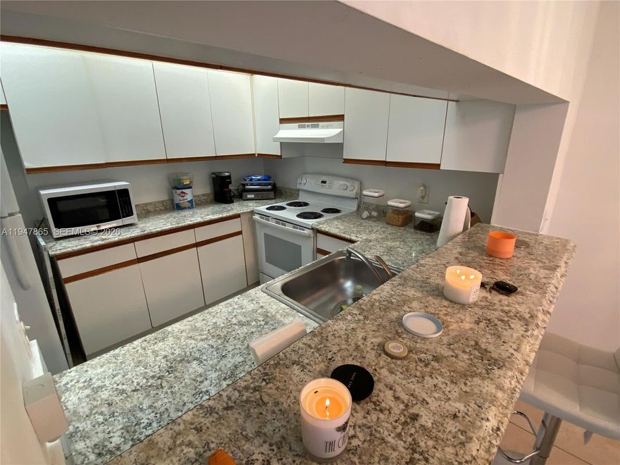 WELCOME HOME!! THIS IMMACULATE HIBISCUS MODEL OFFERS ONE OF THE MOST POPULAR FLOORPLANS WITH A HUGE LIVING ROOM AND DINING ROOM. NEUTRAL TONED CERAMIC TILED FLOORING RUNS THROUGHOUT HOME. THE GOURMET KITCHEN FEATURES GRANITE LIKE COUNTERTOPS AND IMMACULATE APPLIANCES. FOR YOUR PEACE OF MIND THERE IS A SERVICE CONTRACT ON ALL THE APPLIANCES AND A/C. THE OVER SIZED MASTER HAS AN ENSUITE BATHROOM AND PLENTY OF CLOSETS. THE WASHER/DRYER IS IN THE BATHROOM FOR YOUR CONVENIENCE. THIS MODEL IS LARGER THAN THE 2 BEDROOM OLEANDER MODEL WITH A MORE  MODERN FEEL. MOVE IN READY AND PERFECT LOCATION JUST STEPS AWAY FROM THE RESTAURANT AND GOLF COURSE!! YOU CAN WALK TO THE CLUBHOUSE WITH ITS 1000 SEAT THEATER, 1000 PERSON BALLROOM, 2 GYMS, OLYMPIC SIZED HEATED POOL, DOZENS OF CLUBS & COURTESY BUS TO MALLS & HOSPITALS.