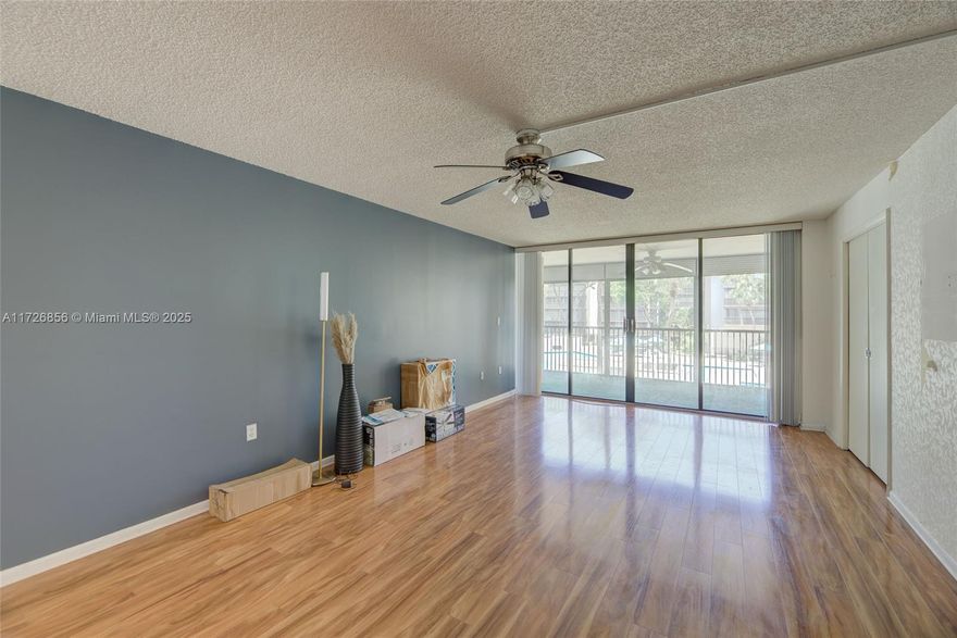 Come see this beautiful, spacious condo located in the amazing Grandview community! This 2 BD, 2 BA unit is filled with natural light! The kitchen features new upgraded stainless appliances! Gorgeous laminate floors throughout all your living space with over 1300 sqft! Newer updated central A/C and washer and dryer Enjoy your morning coffee on your screened-in balcony overlooking the amazing pool! Grandview is an extremely safe community with a manned gate. Get to your unit by elevator or stairs. This community features a beautiful pool and Jacuzzi, a car washing station, and a clubhouse that has billiards and a ping pong table!!! Come visit this turnkey unit!