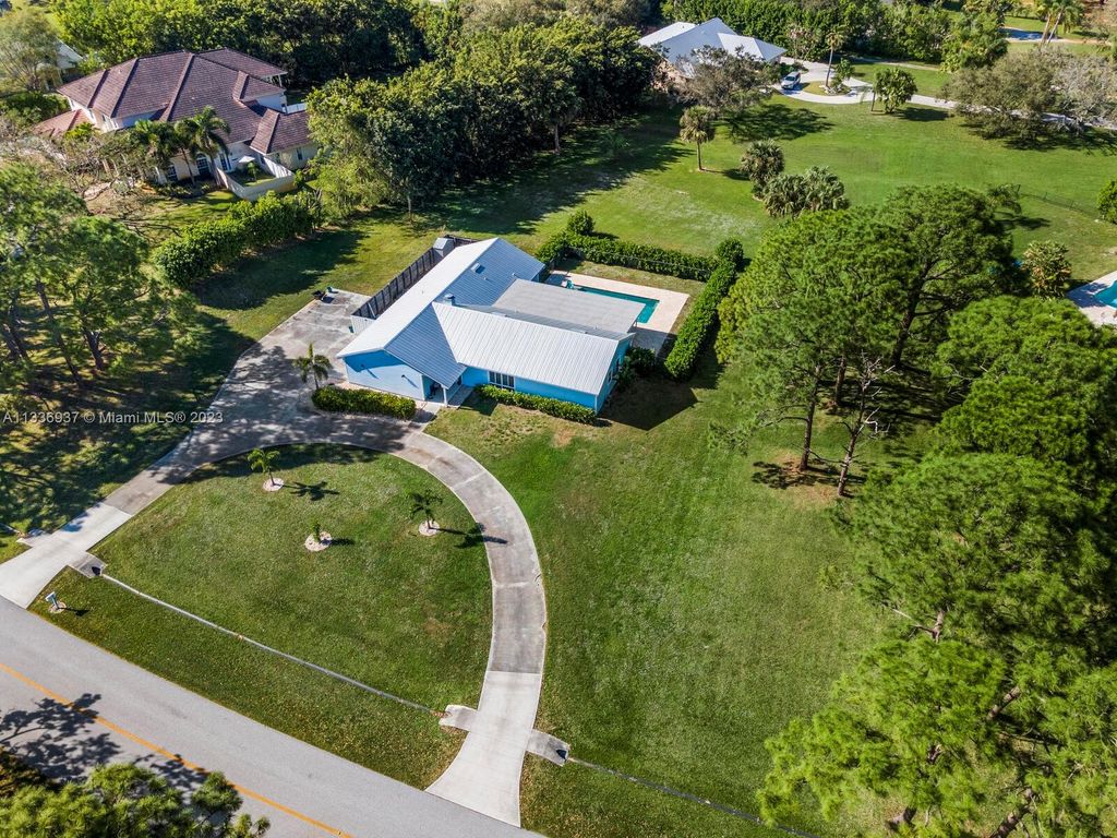 Photo of 3525 SW Racquet Club Way, Palm City, FL 34990 (MLS # A11336937)