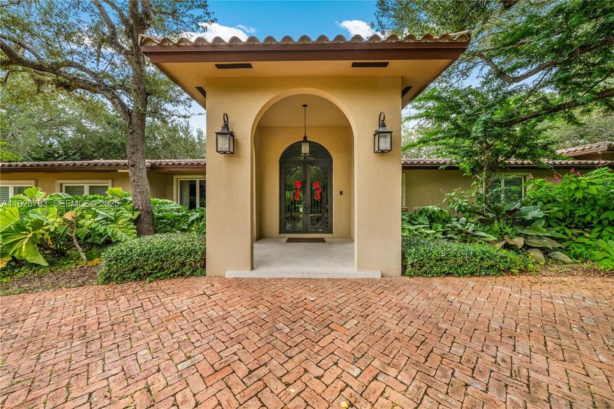 This North Pinecrest Gem has been tastefully updated and is beautifully positioned on this spectacular, oak studded lot! Enter through wrought iron gates to a Chicago brick circular driveway. Gracious entry way flows into an open floor plan, a magnificent kitchen with walnut cabinetry and top of the line appliances. The deep covered terrace is perfect for entertaining, overlooking a spectacular heated pool. The primary suite features 2 walk in closets and sumptuous bathroom which also opens onto pool.
So much space on either side of this gracious home to expand if desired.
Bring your most discerning Clients!