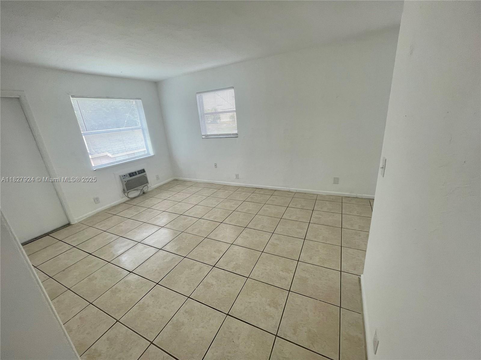 Spacious 2 bed / 1 bath apartment, tile flooring throughout, second floor entry, 1 assigned parking space, shared patio area, new wall A/C unit, freshly painted. No Pets allowed. No evictions or criminal records.