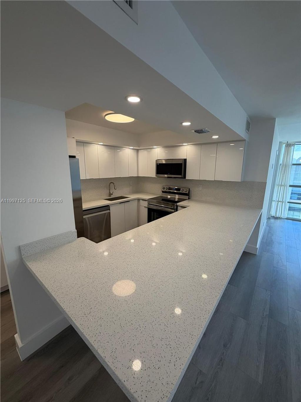 Photo of 851 Three Islands Blvd #512, Hallandale Beach, FL 33009 (MLS # A11997125)
