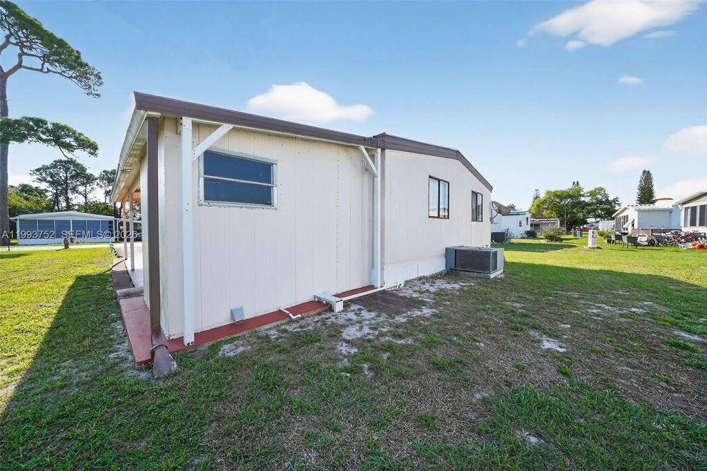 Photo of 415 E Erie Drive, Fort Pierce, FL 34946 (MLS # A11993752)