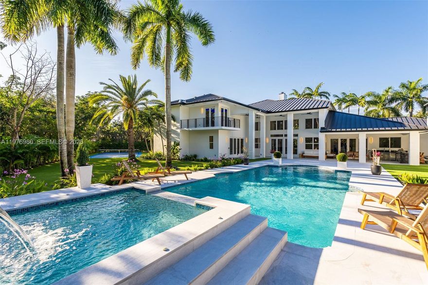 An extraordinary opportunity in Pinecrest, one of South Florida’s most prestigious neighborhoods. This fully renovated estate defines modern luxury, offering over 7,778 square feet of designed living spaces with vaulted ceilings, 7 bedrooms, 8 bathrooms, beautifully polished marble floors, updated bathrooms with Grohe finishes, and a 2 and half car garage. The gourmet kitchen features Thermador appliances, bespoke cabinetry, and quartz counter tops. Enhancing the estate is a beautifully appointed detached guest house offering 3 bedrooms and 3 bathrooms—ideal for hosting or an in-laws quarter. The outdoor experience features a resort-style oasis with a sparkling pool, summer kitchen, expansive entertaining terraces, and a private pickle ball court, all surrounded by lush landscaping. Set on a builder’s acre, this gated corner lot offers added privacy and security. Located in a top-tier school district. A must see, Schedule your private tour today.