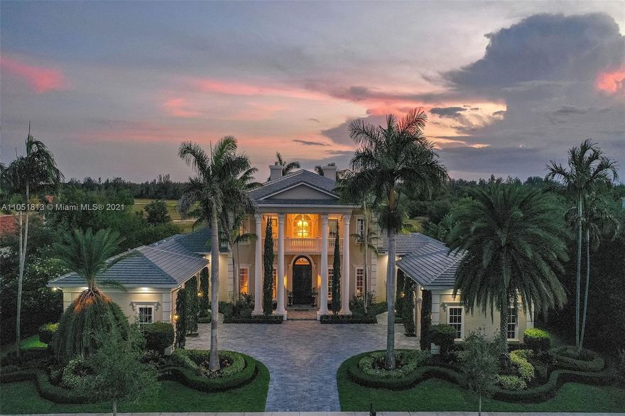 The Grand Estate - Located in prestigious guard-gated Windmill Reserve. Attention nature and bird lovers! Uniquely situated overlooking a preserve, watch the native flora and fauna as if you had a direct window into the Everglades! This stately mansion offers a more formal lifestyle with curated spaces to entertain guests, work from home and enjoy time with family. Amenities include formal lounge w/wet bar and wine room, luxurious formal living room with double-height ceilings, home theatre for movie nights, elegant home office, 5-star first-floor master suite, and plentiful bedrooms for a large family. Kitchen opens up to a family room off pool. Property features brand new roof and gutter systems, elevator, heated pool, gas appliances w/buried propane tank, security cameras - the works!