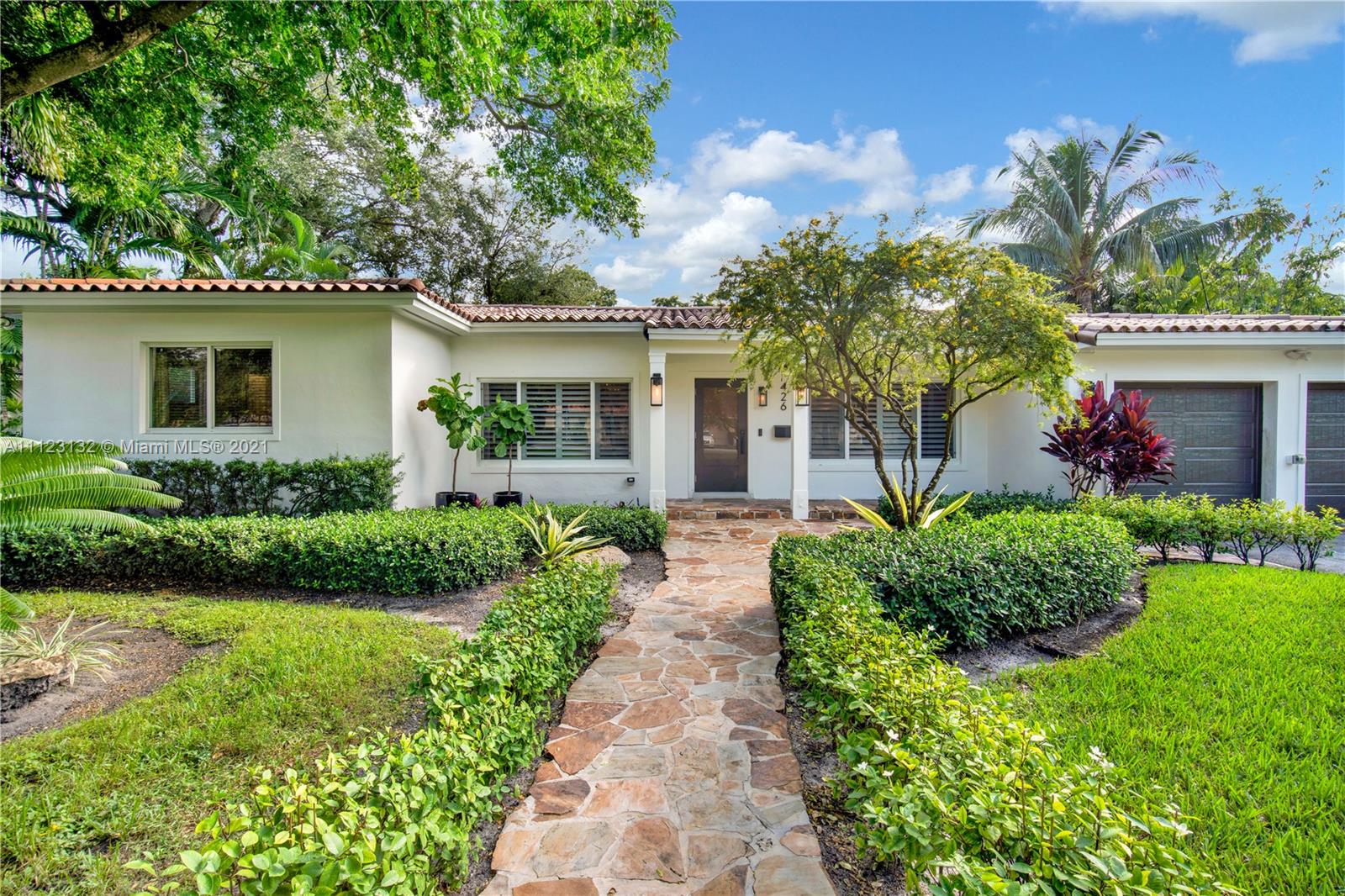 Magazine quality designed house in prime South Gables location completely renovated by the current owner in 2021 with tall vaulted ceilings, an open split floor plan and a huge master suite (expanded in 2013) overlooking a serene and peaceful pool area. This house is perfect for entertaining: the new kitchen has exquisite design including bespoke wood cabinets, a subzero fridge, a gas range and a beautiful quartzite island with lots of storage. It also has a custom bar area with antique mirror and wine fridge. The home has a full outdoor summer kitchen. Large size Italian porcelain floors, 2 A/C zones, 2 water heaters, impact windows throughout, top of the line double garage doors, new plumbing, new electrical panel and wiring, new drain-field and a gym bonus room. Close to UM, top schools