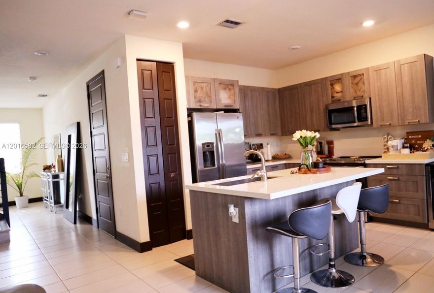 Beautiful townhouse located in the prestigious gated community of Satori in Miami Lakes. This modern residence offers spacious living areas, contemporary finishes, and access to resort-style amenities including clubhouse, pool, fitness center, playground, walking paths, and scenic lake views. Conveniently located near major highways including 1-75, Palmetto Expressway, and Florida's Turnpike, with easy access to shopping centers, restaurants, and top-rated schools.