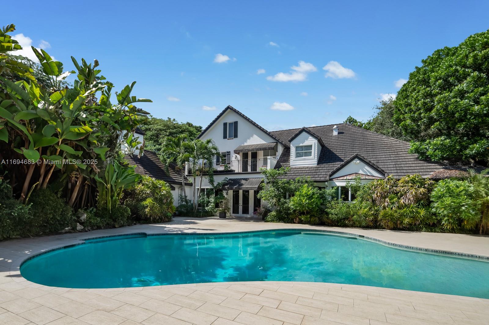 SELLER MOTIVATED! Located near Miami’s top-rated schools, this one-of-a-kind North Pinecrest estate sits on a rare 0.98-acre street-to-street lot. It features 6 bedrooms, 6 full and 2.5 baths + 2 additional rooms perfect for a gym, theater, or office. Renovated in 2016, with soaring ceilings, impact windows/doors, a chef’s white kitchen with large island, walk-in pantry, and breakfast area. The primary suite offers a spa bath and walk-in closet. Enjoy a heated saltwater pool, pergola, BBQ gazebo with cabana bath, majestic oaks, and landscape lighting. Privacy and security include gated electric entrance, wall, fence, and neighborhood patrol. Countless storage closets, elevator, laundry room, and generator with 1,000-gallon tank complete this unique home featured in a Telemundo episode.