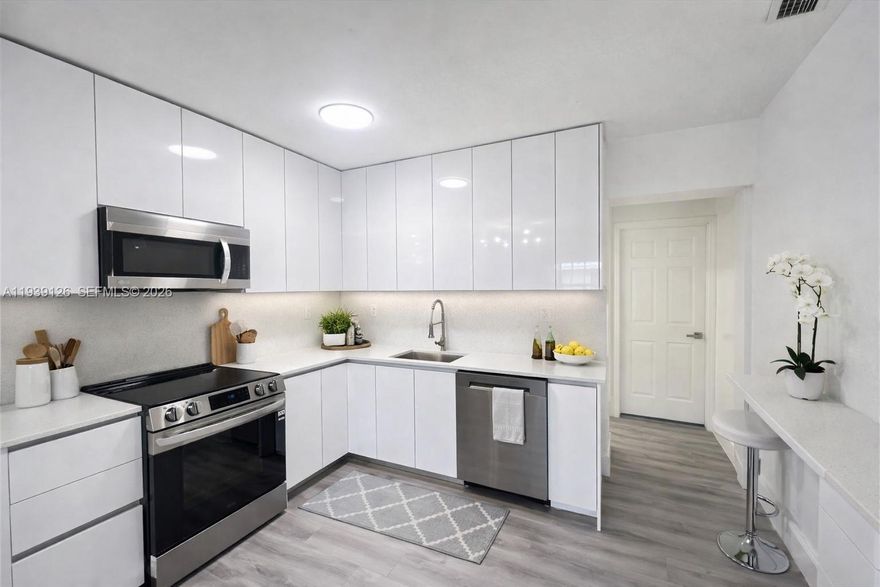 MOVE IN WITH JUST TWO MONTHS! Beautifully renovated 3-bedroom, 1-bath home in the heart of Miami Gardens. Features a modern kitchen with stainless steel appliances, luxury countertops, high-end cabinetry, and pantry. Central A/C, washer and dryer, and accordion shutters for added protection. Fully fenced yard ideal for BBQs, space for a pool, outdoor entertaining. Front entrance only. Parking for up to 5 vehicles. Commercial vehicles are ok.  Centrally located within walking distance to shops and schools. No HOA. Fast approval. Vacant and ready for immediate move-in.