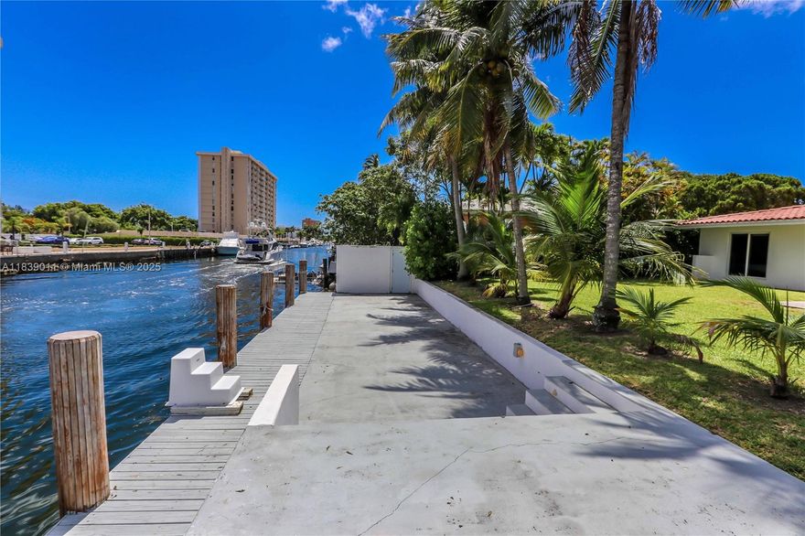 Incredible opportunity! Fully furnished with Ocean access through Bal Harbour. Waterfront home in the Prestigious Keystone Point area! With boat dock available, boasting 75' of deep water frontage with direct access to the bay! No fixed bridges. This spacious 3 bedroom 2 bath property is very nicely updated. Offering a large open concept kitchen with a cooking island, dining area and stainless steel appliances. Open layout living area with ceramic flooring, hurricane impact windows, and washer/dryer in the 1 car garage. Circular driveway provides plenty of parking. A large backyard, perfect for entertaining! Semi-private neighborhood. Gated Community with 24 hour Security. Close to shops, restaurants, schools, and so much more! Comes furnished!