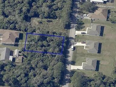 This vacant lot is located in the rapidly growing city of Palm Bay. Whether you're looking to build your dream home, expand your investment portfolio, or enjoy a piece of Florida's natural beauty, this lot offers endless possibilities. Situated in a peaceful, residential neighborhood, this lot boasts excellent potential! Close proximity to I-95, stunning beaches, shopping, dining, and recreation. Don't miss out on this exceptional opportunity! Palm Bay is one of Florida's fastest-growing cities, offering affordability, convenience, and quality of life. With a strong sense of community and a wide range of amenities, it's a great place to live, work, and play. A boundary survey is available upon request.