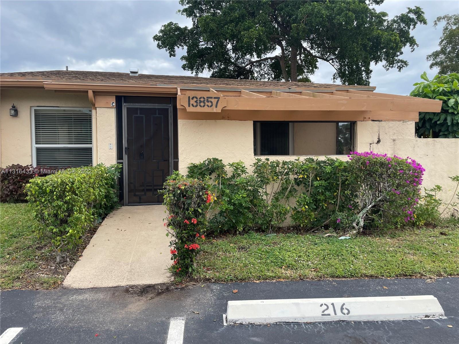 Wonderful two bed, two bath end unit villa in the lovely Palm Greens community. Community offers amazing amenities such as pool, tennis, gym, activity rooms and more. Updated kitchen, tile flooring all throughout, walk in closet in primary room, updated hurricane impact windows. Water and cable included. Access to the back yard through main living area as well as primary room. Enjoy watching the sunrise and sunsets in either the front or back patio. Great location just miles from Florida beaches. 55+ community.