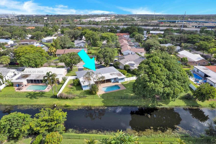 Discover this stunning, southeast-facing 4-bedroom, 3-bathroom saltwater pool home on an oversized corner lot with beautiful canal views. Located in a family-friendly neighborhood, just minutes from restaurants, parks, and supermarkets, and just a short drive from Fort Lauderdale or Dania beach! You'll have peace of mind and enjoy insurance savings with a 2022 shingle and flat roof, and electrical panel, 2021 pool pump, 2014 impact windows and doors, and a 2018 A/C unit with new 2020 ductwork and insulation. This home also features PVC pipes throughout and a cost-saving sprinkler system fed by the canal for a lush, green lawn. The family room could also be used as a secondary master. Ample space for your boat, RV, or any other toys in the fully fenced backyard with a PVC double-door fence.