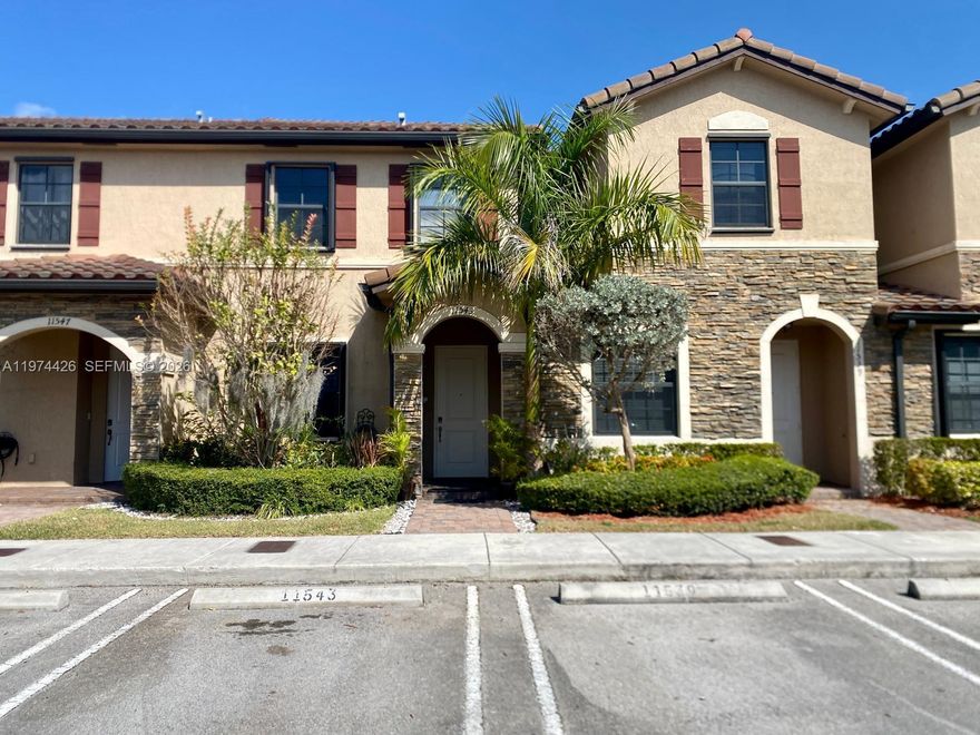 Beautiful townhome in Artesa at Coco Palm Estates in Homestead (Exit 9B Turnpike) featuring a spacious living room with fireplace, bar, and mounted TV, upgraded kitchen with stainless steel appliances and granite countertops, half bath on the first floor, storage under the stairs, and a versatile den ideal for a home office or additional living space.  Upstairs offers 2 bedrooms, 2 full bathrooms, and in-unit washer and dryer, plus a private backyard with gazebo/pergola perfect for entertaining.  Hurricane shutters installed. Townhome located in a gated community with resort-style amenities including pool, jacuzzi, clubhouse, gym, basketball and volleyball courts, beautiful lakes, fountains, walking trails, guest parking.  2 two assigned spaces in front of the property.
Easy access to the Florida Turnpike, near supermarkets, shopping, restaurants, and schools.
*Furnishings are digitally staged and for illustrative purposes only.