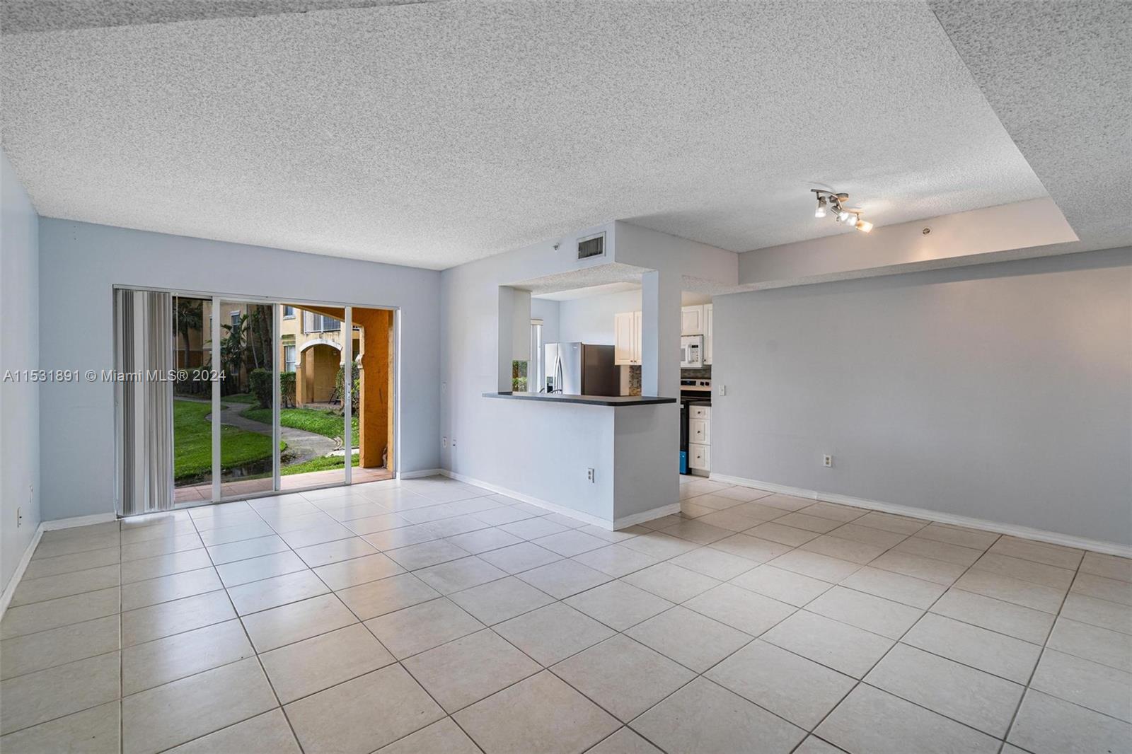 Discover serene lakeside living at La Via in Pembroke Pines, FL! This ground-level 3BD/2BA condo offers 1,147 SF and a scenic lake view. Inside, find tile floors throughout, new oven and refrigerator, a laundry room with a full-size washer/dryer. Relax in the spacious bedrooms, including a master suite with en-suite bath and walk in-closet. Outside, enjoy the patio overlooking the lake. With 1 assigned parking space, multiple guest parking spaces, gated community security, and amenities like a pool, tennis court, playground, and fitness center, this is lakeside living at its finest! Close to numerous retail and dining options off Pines Blvd and near Tanglewood and Taft/Johnson Linear Parks.