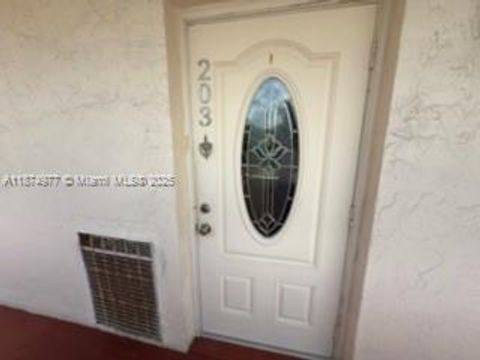 Photo of 300 S Hollybrook Dr #203, Pembroke Pines, FL 33025 (MLS # A11874977)