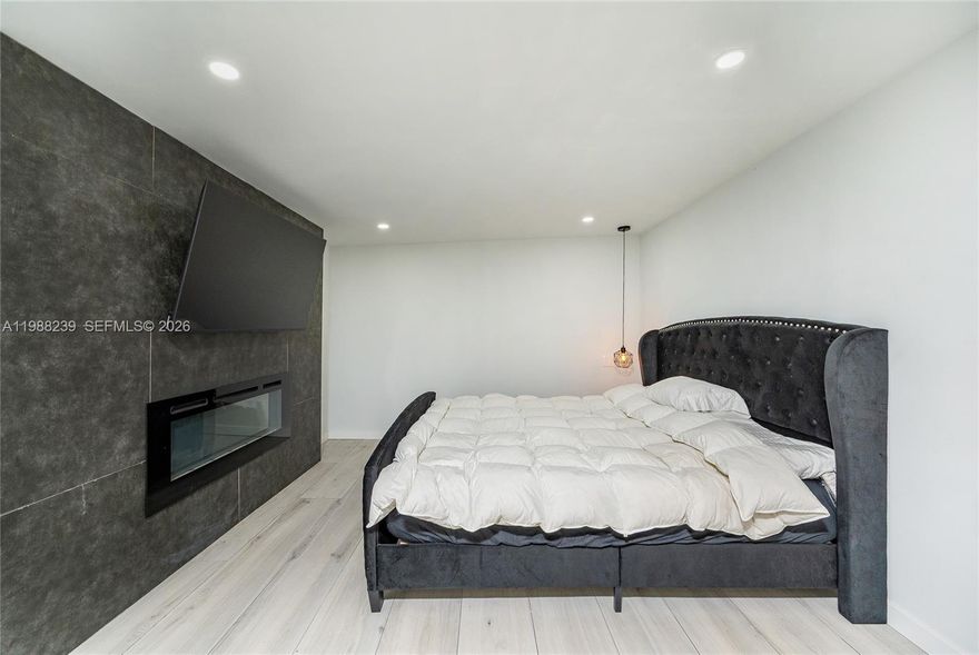 Spacious and beautifully updated studio featuring an open-concept layout with modern, high-end finishes throughout. This larger unit offers a sleek kitchenette with quartz countertops, custom cabinetry, and ample storage, complemented by elegant wood-look tile flooring and recessed lighting. The expansive living area allows for flexible living and sleeping spaces, creating a comfortable and functional flow.
The standout feature is the designer bathroom, showcasing a spa-inspired walk-in shower with custom tile work, rainfall shower head, and contemporary finishes that elevate the entire space.
Located in a quiet, family-friendly neighborhood between Palmetto Bay and Cutler Bay, with easy access to shopping, dining, major roadways, Zoo Miami, parks, and top local attractions. A rare opportunity to enjoy modern living with space, style, and a luxury feel (includes utilities).