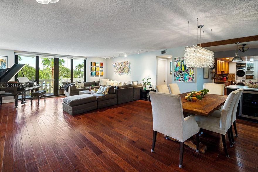 One of the largest true 3 Bedroom, 3 Bathroom units in the Towers of Key Biscayne with 2,200+ square feet and an expansive balcony. Modern layout with open floor plan, new living room built-ins with 90 inch television(included), and recently renovated bathrooms. Includes two parking spots and potential for upper garage golf cart parking spot assignment (subject to association approval). Unit has been in owner's family for 40+years. Washer, dryer and dishwasher have all been recently updated.