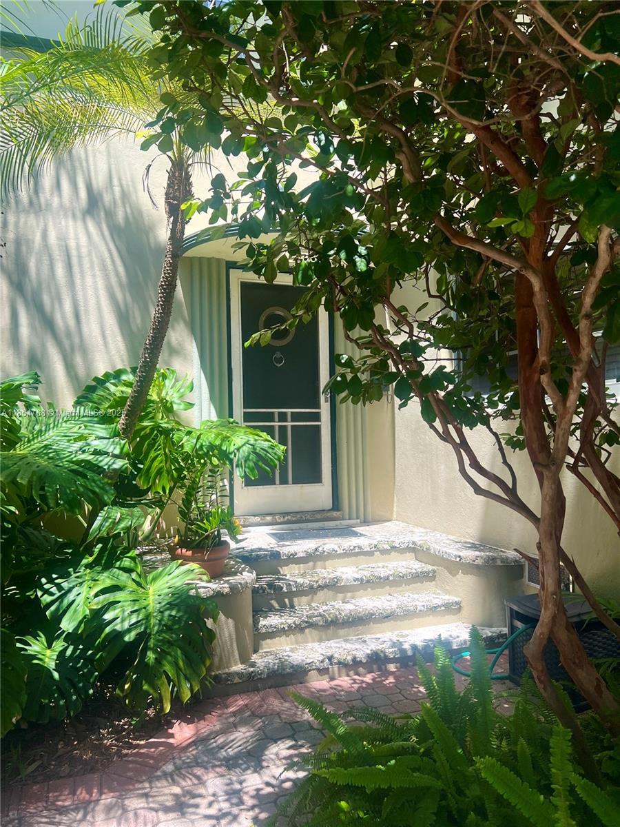 Truly one of a kind and rarely available, this exquisite 2-bedroom Art Deco residence has been meticulously restored. The home has 10ft ceilings, hardwood floors, & a beautifully refurbished working gas fireplace. The home exudes timeless charm. The spacious living room offers ample space for relaxing or entertaining. One of the bedrooms features elegant terrazzo flooring, making it ideal as a guest room/home office. The primary bedroom easily accommodates a king-size bed. The eat-in kitchen provides generous workspace & opens to an outdoor area with a BBQ and multiple seating areas—perfect for al fresco dining. Additional highlights include a washer/dryer area and a composting setup. Enjoy your assigned driveway parking space under the shade trees, just steps from your private front door.