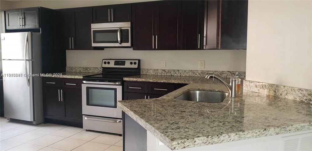 Photo of 8977 Wiles Rd #108, Coral Springs, FL 33067 (MLS # A11813245)