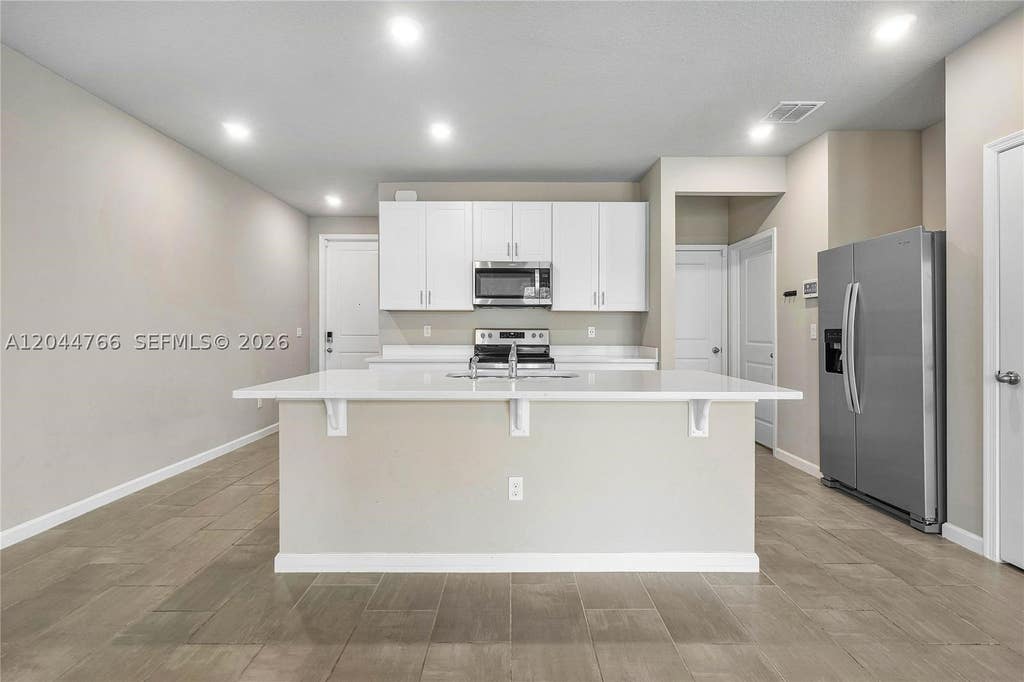 Photo of 1649 Lindley St #1649, Mangonia Park, FL 33407 (MLS # A12044766)