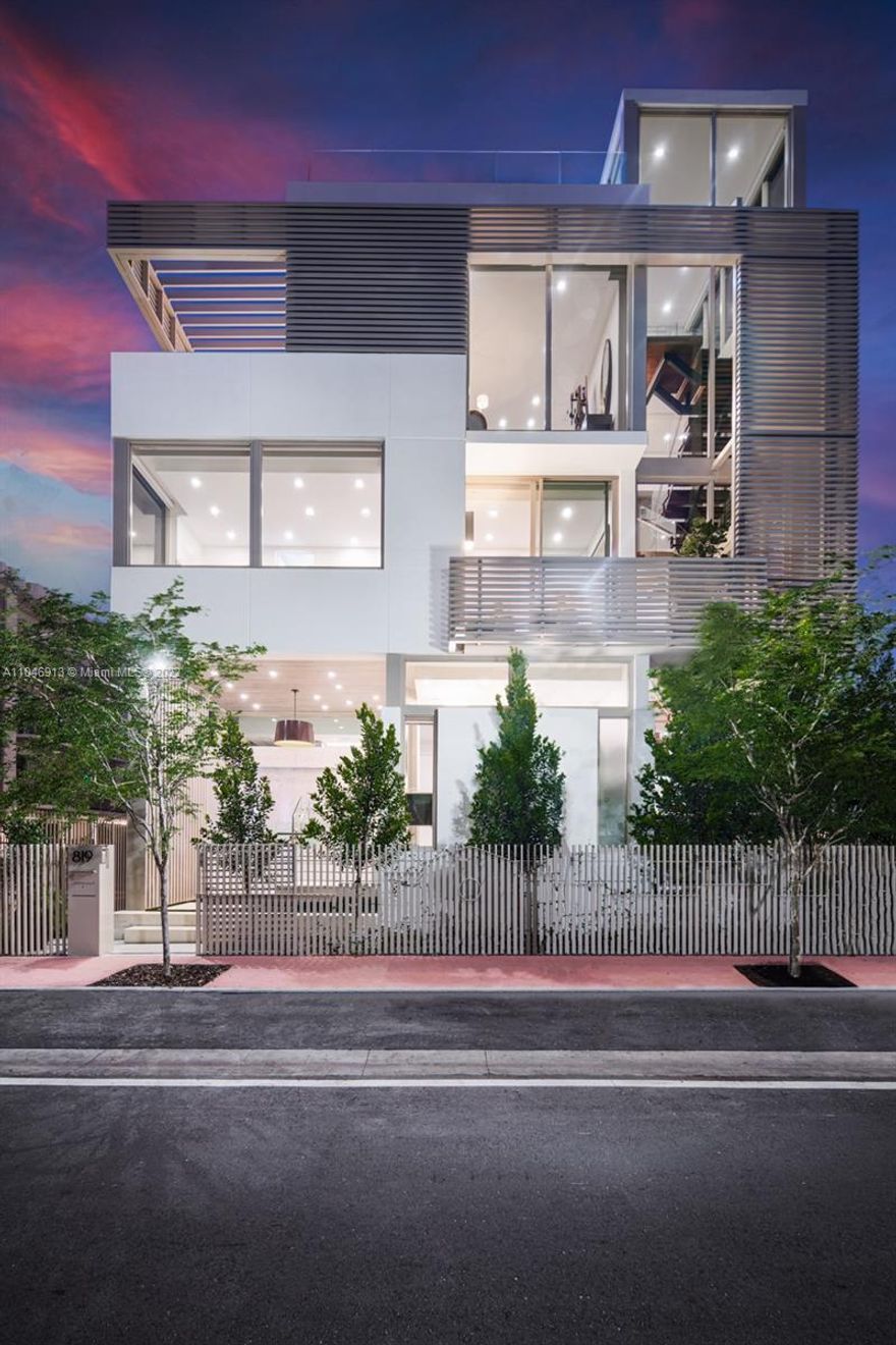 In a league of its own: Completed in 2021, this tropical modern South of Fifth single family home has no parallel. Conceived by renowned architecture firm Choeff Levy Fischman, the sculptural staircase, natural light and design aesthetics truly impress. With 3 bedrooms + gallery/media, 5 baths, this house boasts 10’ ceilings. Take the elevator to the 1,250SF rooftop complete with a spa, retractable roof, Summer kitchen, TV, and jaw dropping Downtown views & magical Sunsets. Revel in interior details such as walnut flooring, speciality tile work, Wolf and Subzero appliances, custom bar, A/V automation, Lutron shades. Completed by a 2 car garage with commercial door + 2 car covered carport, & private entry. Live the SoFi lifestyle: mornings in the Park, lunch at Milo’s, dinner at Carbone.