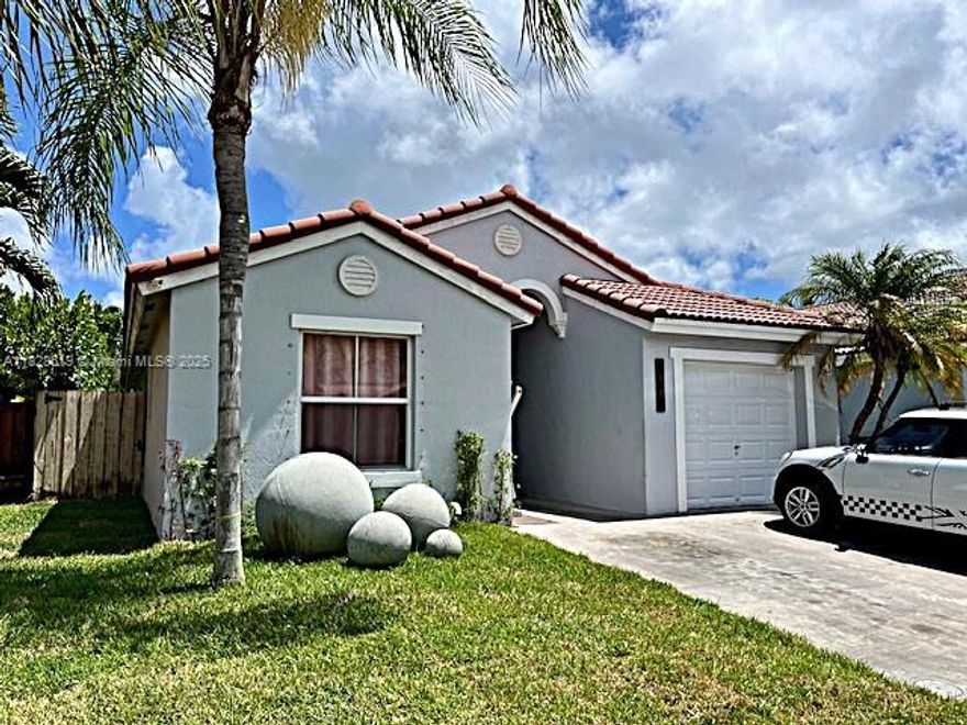 Great home in the Shores at Keys Gate, the largest neighborhood in keys gate. This single-family home features 3 bedrooms and 2 baths with an additional room for office or 4th bedroom. Updated kitchen cabinets, tile floors throughout and laminate wood floor in bedrooms. Newer A/C system with warranty through 2029 and new tankless water heater. This home has a lot of extras, it's smart wired with cameras and has outdoor lighting throughout. Beautiful backyard with synthetic grass, covered patio, modern outdoor kitchen with fans and lighting for a comfortable outdoor living. Complete hurricane shutters, extra storage areas and more. Maintenance fee includes; High speed broadband internet, Cable TV and ADT alarm service.  Easy to show call listing agent.