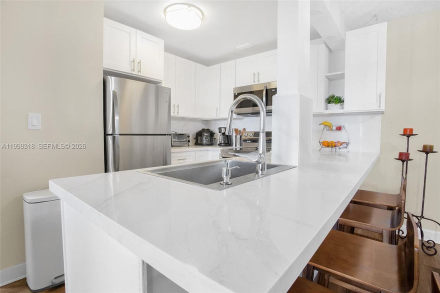 Beautiful 2-bedroom, 2-bathroom residence featuring a thoughtfully updated interior and serene lake views. The renovated kitchen offers modern finishes and brand-new appliances (2025), creating a functional and inviting space. The property includes several key upgrades for added value and peace of mind, including a new electrical panel (2023), air conditioning system (2024), updated A/C ducts (2025), impact windows (2025), and water heater (2024).

Enjoy a bright and comfortable layout in a centrally located building, with convenient access to shopping centers, grocery stores, and major roadways. This residence offers a great combination of recent improvements, location, and views, making it an excellent opportunity for both end-users and investors.