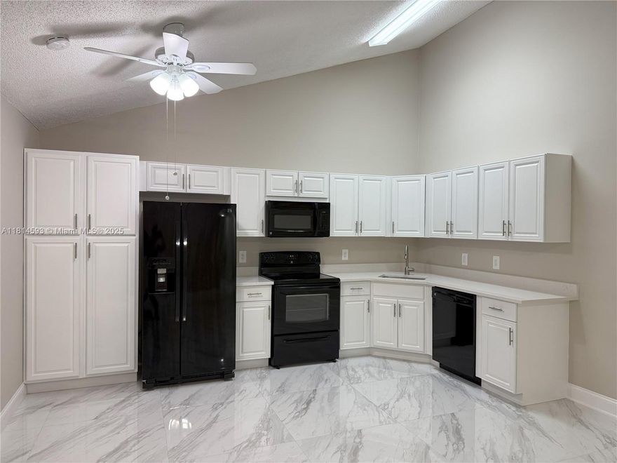 Move right away into this beautifully renovated 3 bed and 2 bath townhome located in the highly desirable Westwood Gardens community of Palm Beach Gardens. Offering 1,285 sq ft of modern living space, home features a modern style, comfort, and functionality; adding a spacious screened patio. 

Step inside to find elegant porcelain tile flooring throughout, giving the entire home a sleek and cohesive look. The kitchen and bathrooms have been thoughtfully upgraded with quartz and marble countertops, brand-new vanities, and contemporary glass shower doors, creating a luxurious feel in every corner. 

Enjoy peace of mind with a completely renovated plumbing system, along with new laundry appliances for your convenience.  All closets have been customized with Closet Evolution systems.