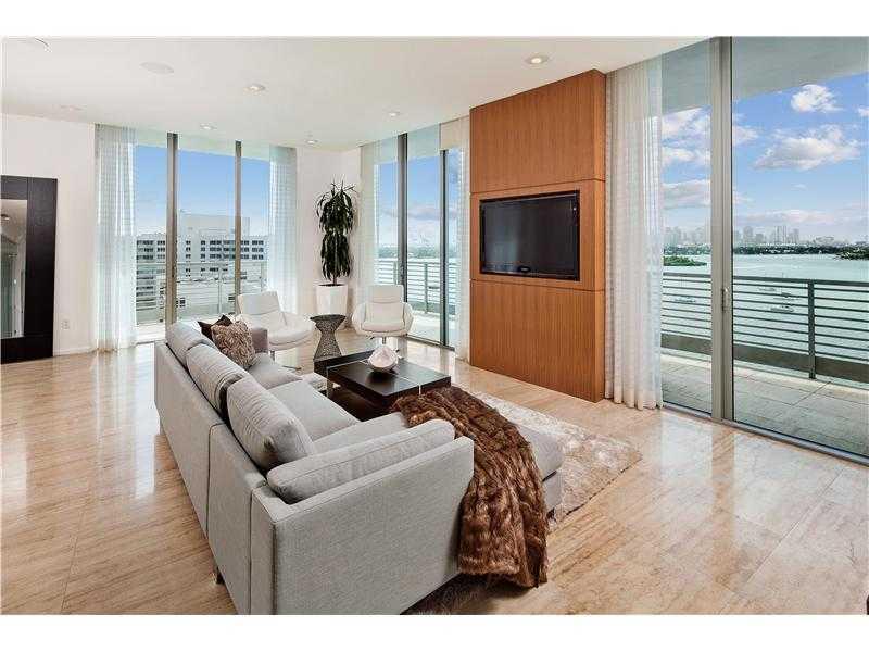 This is THE premier Penthouse on the entire west side of SoBe! This contemporary home boasts panoramic views of the open bay and breathtaking Miami skyline from every room! Features include high ceilings, marble floors, custom lighting, sound system, chef 's kitchen, walk-in wine cellar, four balconies and an expansive 2,500+/-sq/ft private rooftop terrace with summer kitchen, bar, hot tub, full bath and outdoor showers, all directly on the bay. Includes 30' boat slip in private marina!