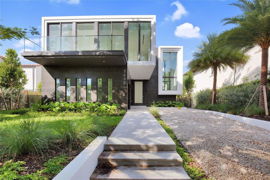 Exquisite 2022 built home is a 4,062 sq ft designer tropical retreat, nestled on prestigious Pine Tree Drive in Miami Beach. A short distance to beaches, world-class dining, and elite shopping. This resort style 5 beds, 5.5 baths residence offers a private pool, heated spa, and rooftop terrace. Spacious open layout with dramatic 10–22 ft ceilings, sleek Italian flooring, linear air diffusers, and impact-rated glass windows and doors. Gourmet Italkraft kitchen features Consentino countertops, Sub-Zero appliances, and premium gas cooktop. Outdoor kitchen has gas BBQ, shower, and lush landscaping. Floating oak staircase leads to expansive bedrooms with en-suite baths. This home features custom vanities and premium Hansgrohe-Axor fixtures. A sophisticated sanctuary in the heart of Miami Beach.