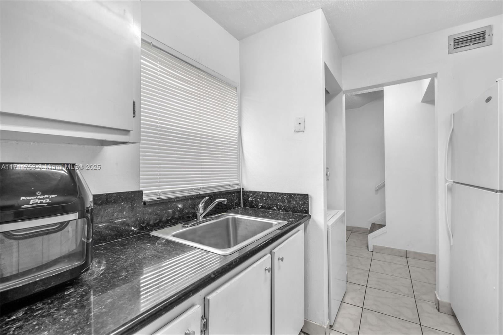 Great location and convenience for proximity to schools, parks, shopping, restaurants, or public transportation. Huge 2-bedroom 2-bathroom Townhouse with some moderations made to add shower and an additional bedroom downstairs. 2 upstairs bedrooms that can fit king size furniture, laminate flooring upstairs and ceramic tile downstairs, washer dryer in kitchen make this house a great layout for the whole family. Additional bedroom for elderly and/or students that want privacy. Endless possibilities for buyer to customize the space and get instant equity. This home can be your and is a great value. A must see! Call or email to set an appointment today!