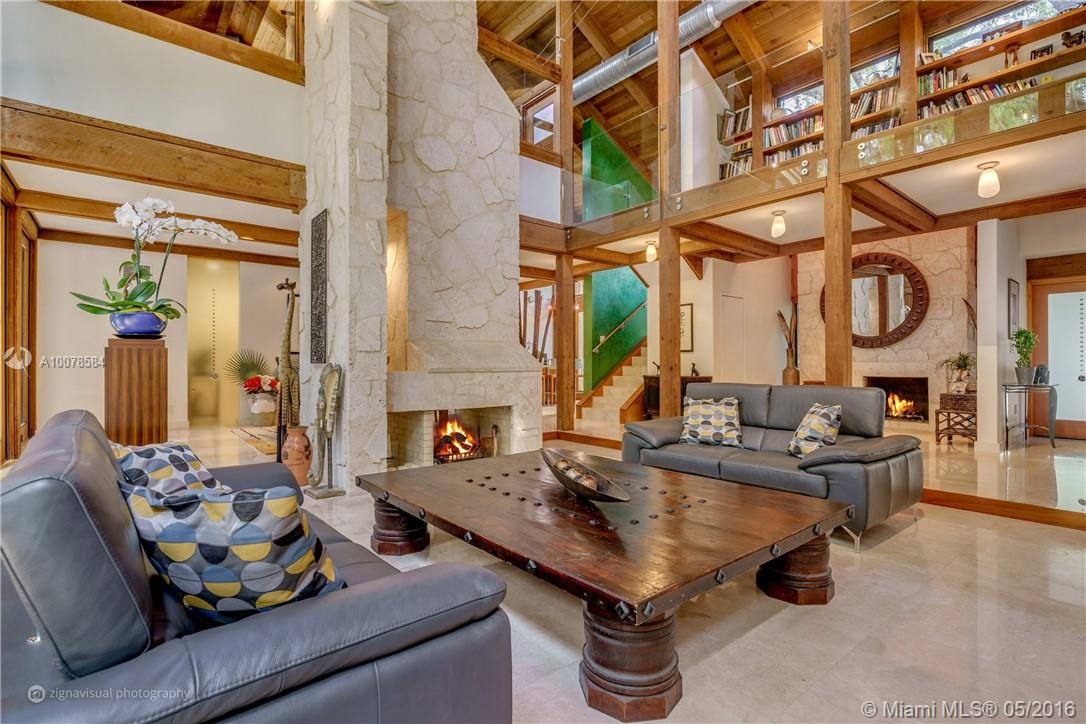 Unique contemporary California style home situated in coveted Coconut Grove. Oversized lot with a tropical botanical garden graced by a five tiered pool with cascading waterfalls. This 2 story estate with high ceilings features 5 bed & 5.5 baths, superior craftsmanship & materials including cedar, marble, venetian plaster & Murano glass throughout, 3 fire places, underground wine cellar, office, library, and a guest house. Ideally close to great schools, airport, downtown & the iconic CocoWalk.